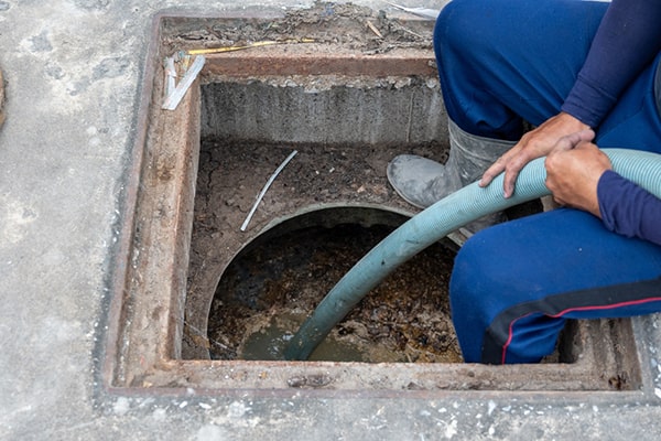 signs that your grease trap needs pumping include slow drains, foul odors, and visible grease buildup